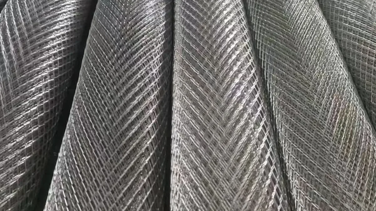 Galvanized welded wire mesh rolls showing regular welded grid openings and roll texture for export specification checking
